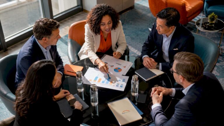 Corporate leaders discussing leadership training alignment