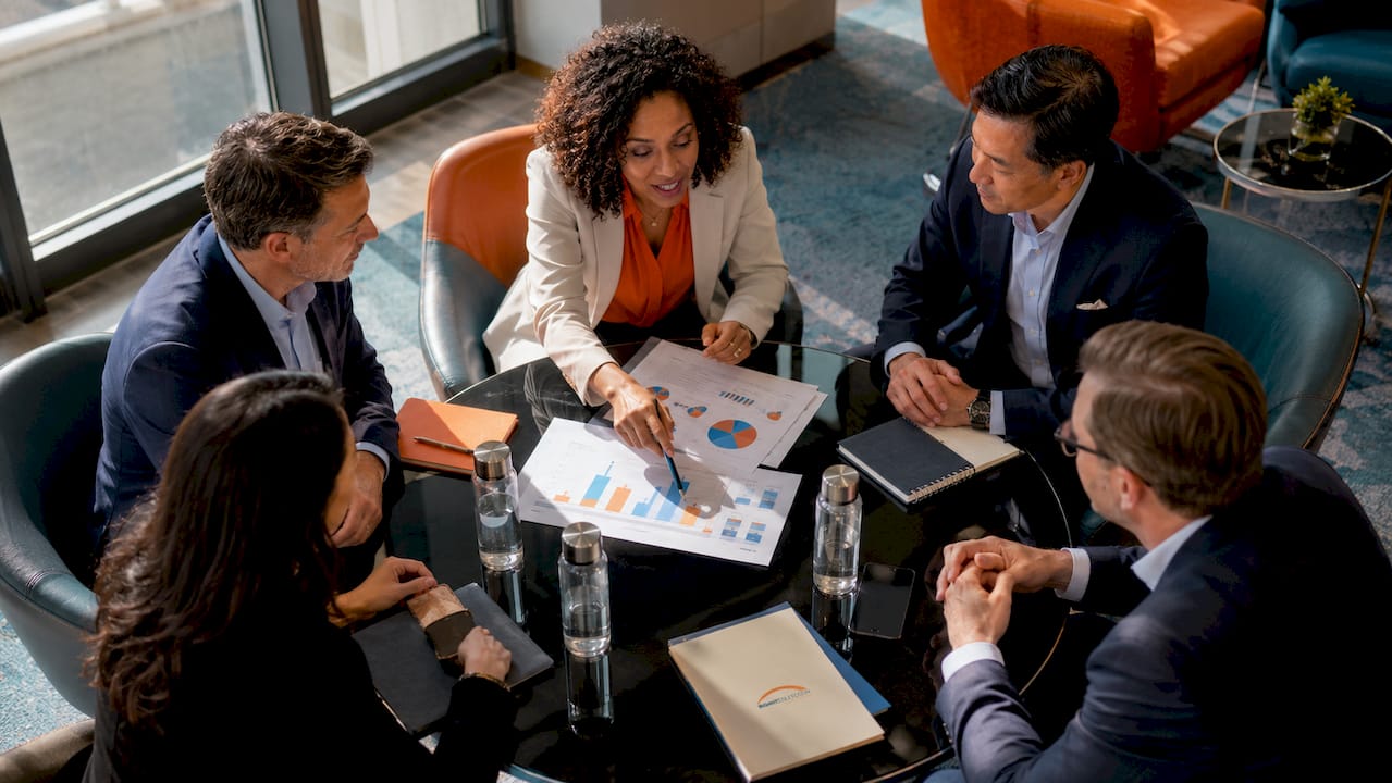 Corporate leaders discussing leadership training alignment