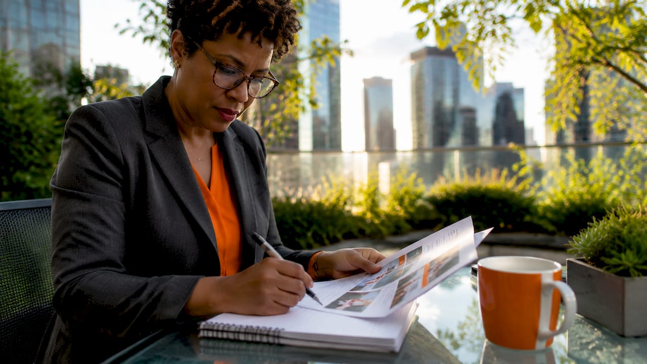 Executive woman reviewing leadership program materials