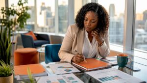 Woman reviewing leadership development plans in office