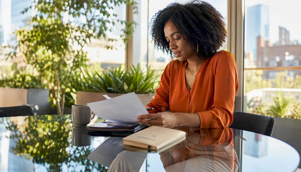Woman preparing speaker introduction notes
